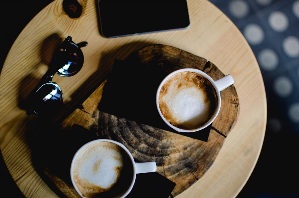 Free Image of Two Cups of Coffee on Wooden Table 