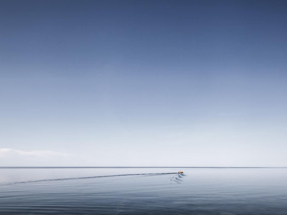 Free Image of Solitary Boat Adrift in Vast Water 