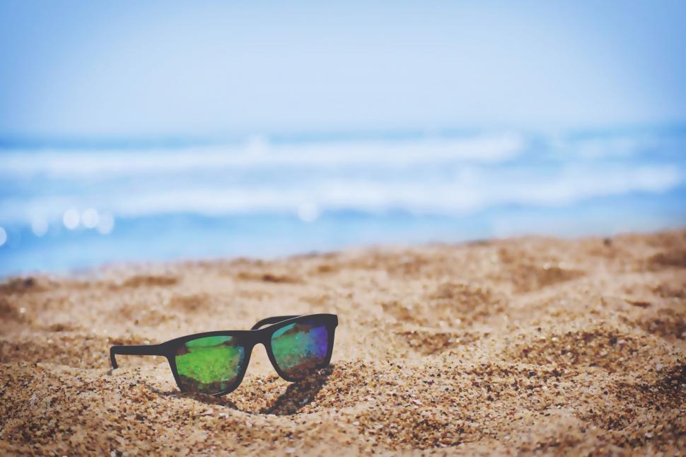 Free Image of Sunglasses on Sandy Beach 