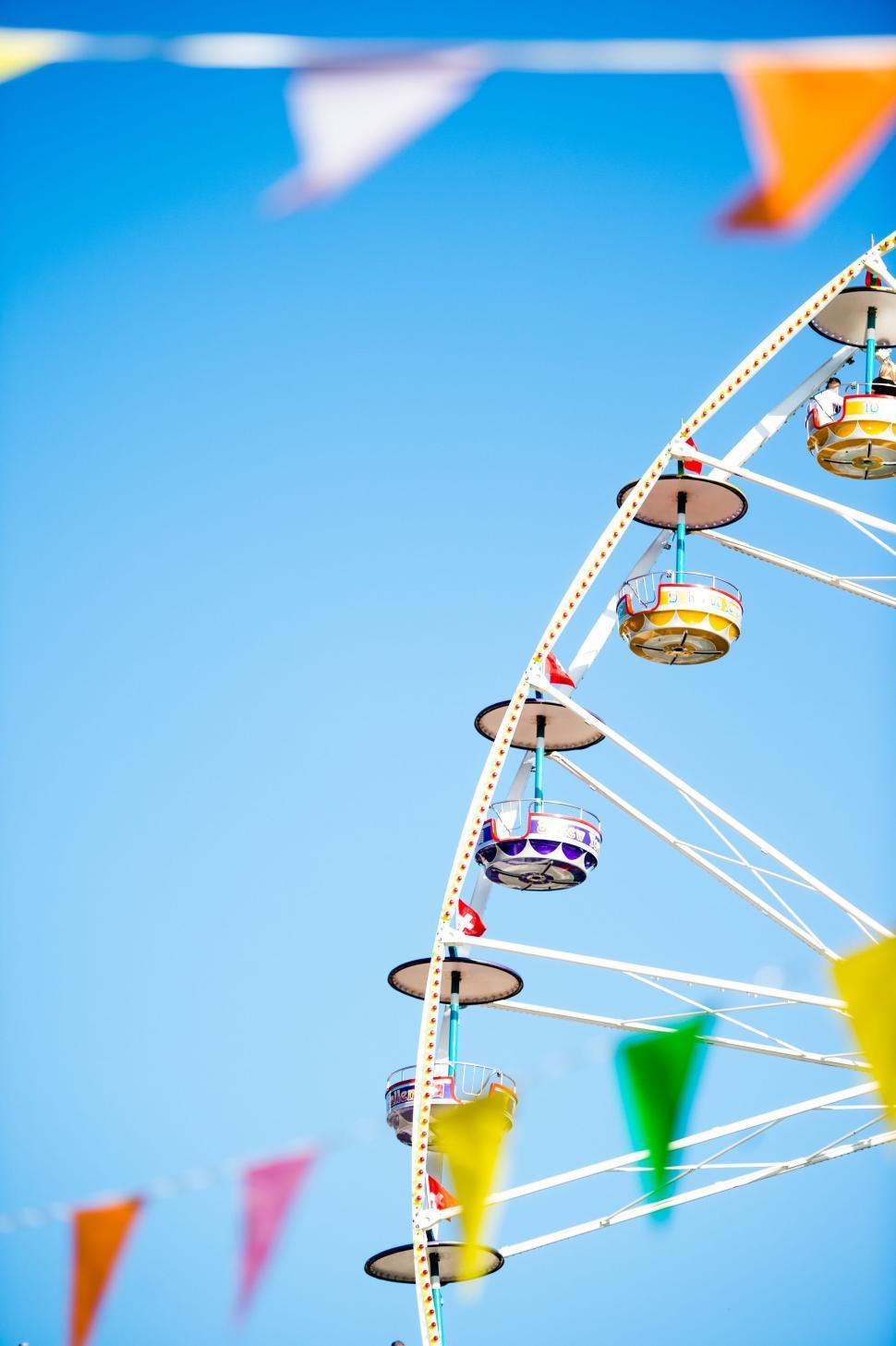 Free Image of Ferris Wheel Against Blue Sky 