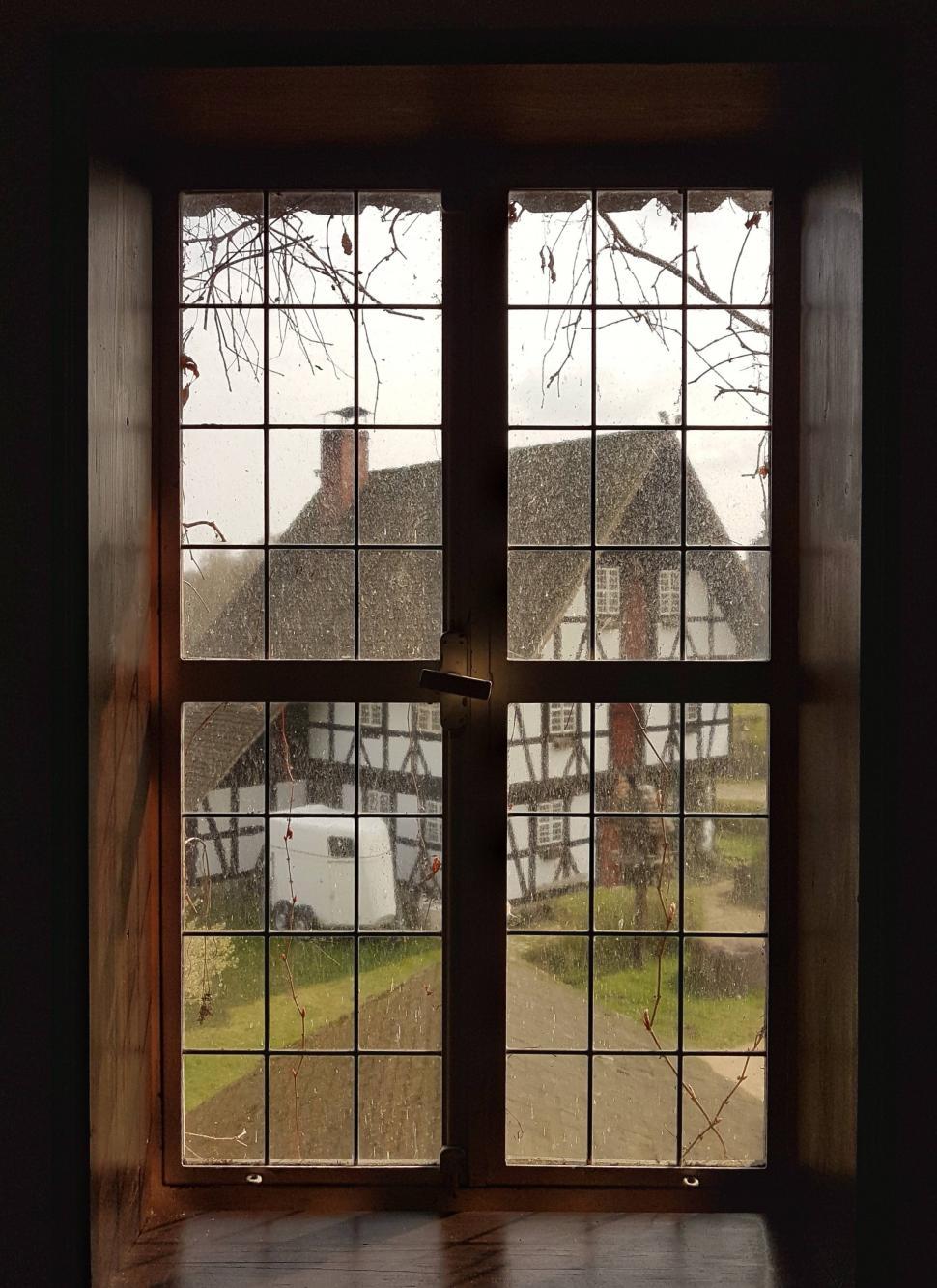 Free Image of View of a House Through a Window 