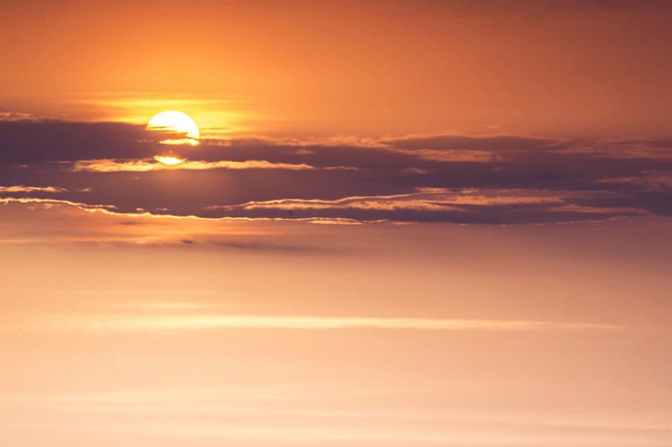 Free Image of Sun Setting Over Horizon of Ocean 