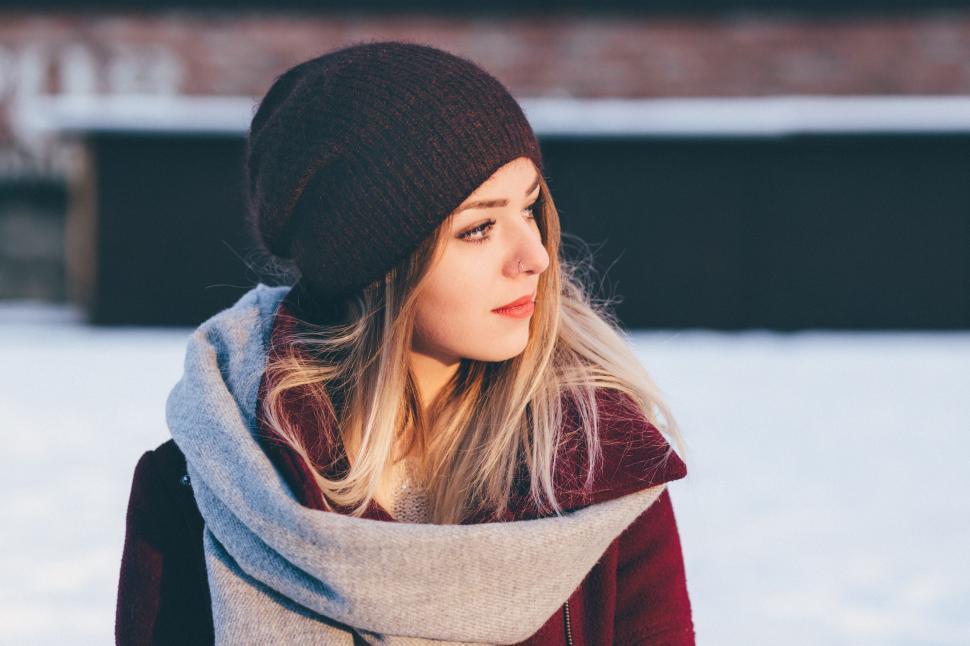 Free Image of Woman Wearing Beanie and Scarf in Snow 