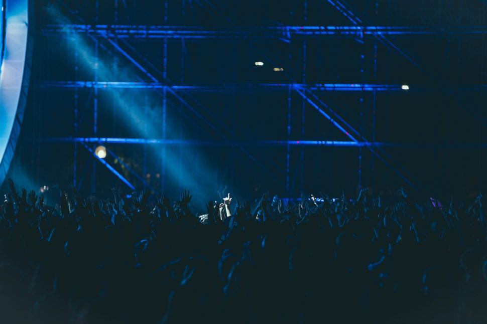 Free Image of Crowd of People Standing on Top of a Stage 