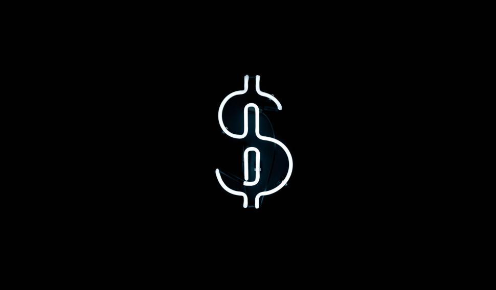 Free Image of Vibrant Neon Dollar Sign on Black Background 