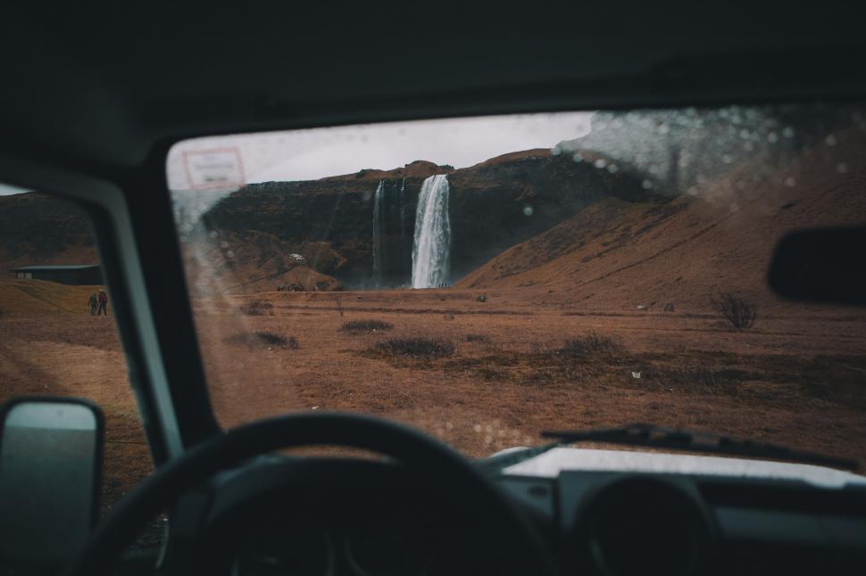 Free Image of Waterfall View From Inside Vehicle 