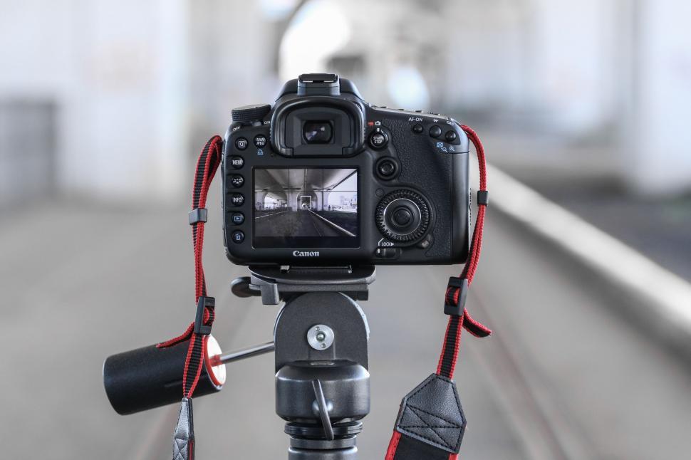 Free Image of Camera Attached to Tripod on Street 