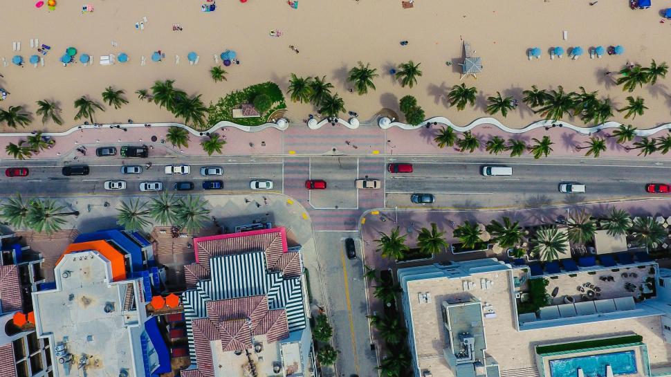 Free Image of Aerial View of Beach With Cars Parked 