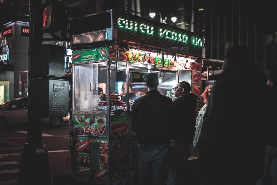 Free Image of Group of People Standing Outside Food Truck 