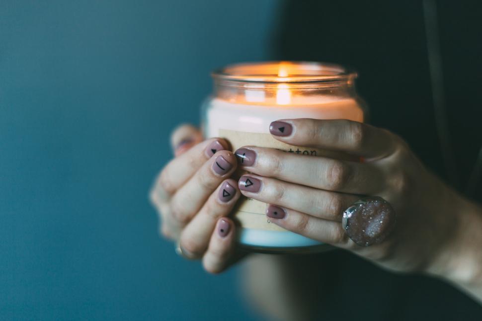 Free Image of Woman Holding a Lit Candle 