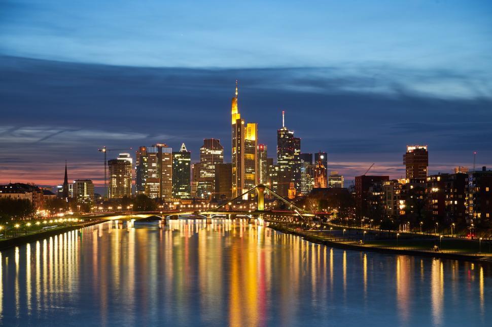 Free Image of City Skyline Illuminated Across the River at Night 