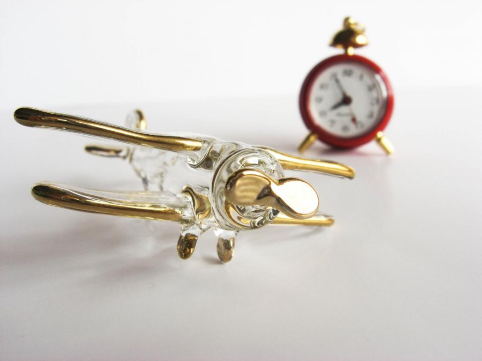 Free Image of airplane figurine and clock 