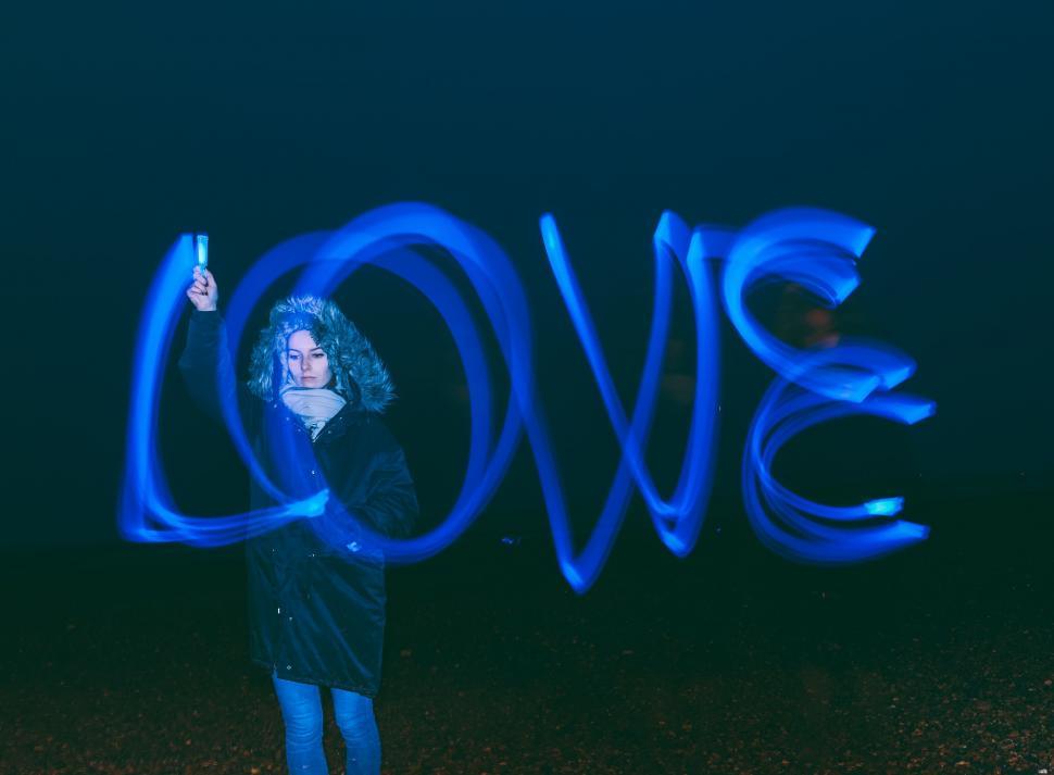 Free Image of Woman Holding Light Painting in Field 
