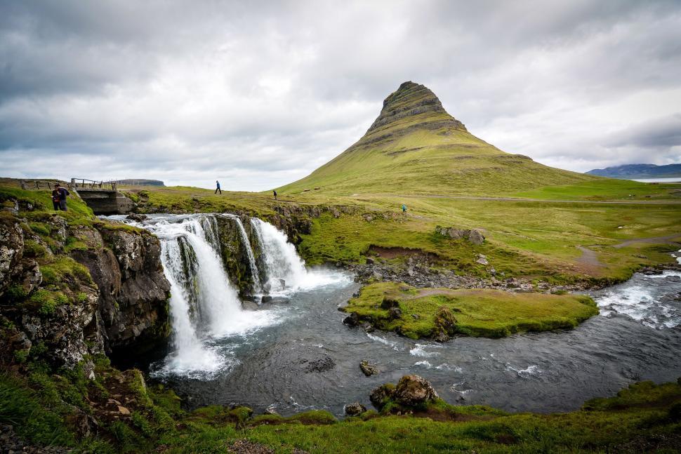 Free Image of Waterfall in the Middle of a Lush Green Field 