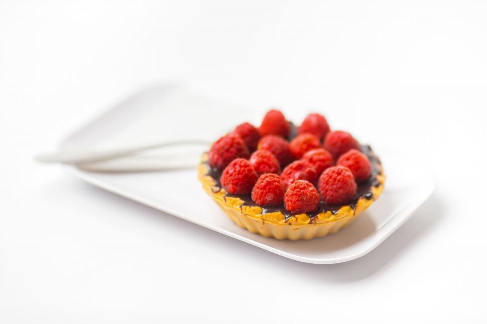 Free Image of Raspberry Tart on a White Plate With a Fork 