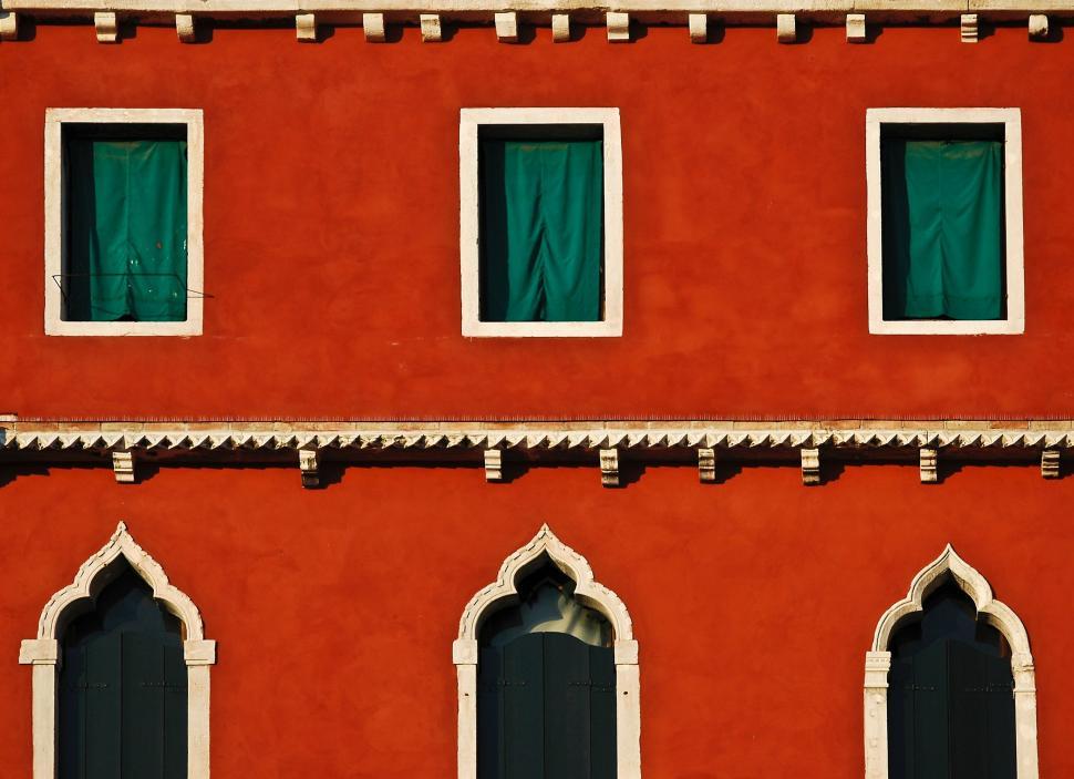 Free Image of Red Building With Green Windows and Clock 