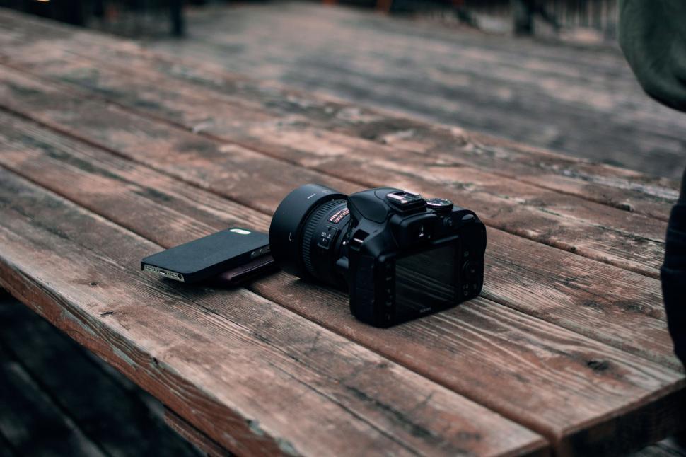 Free Image of Camera on Wooden Table 