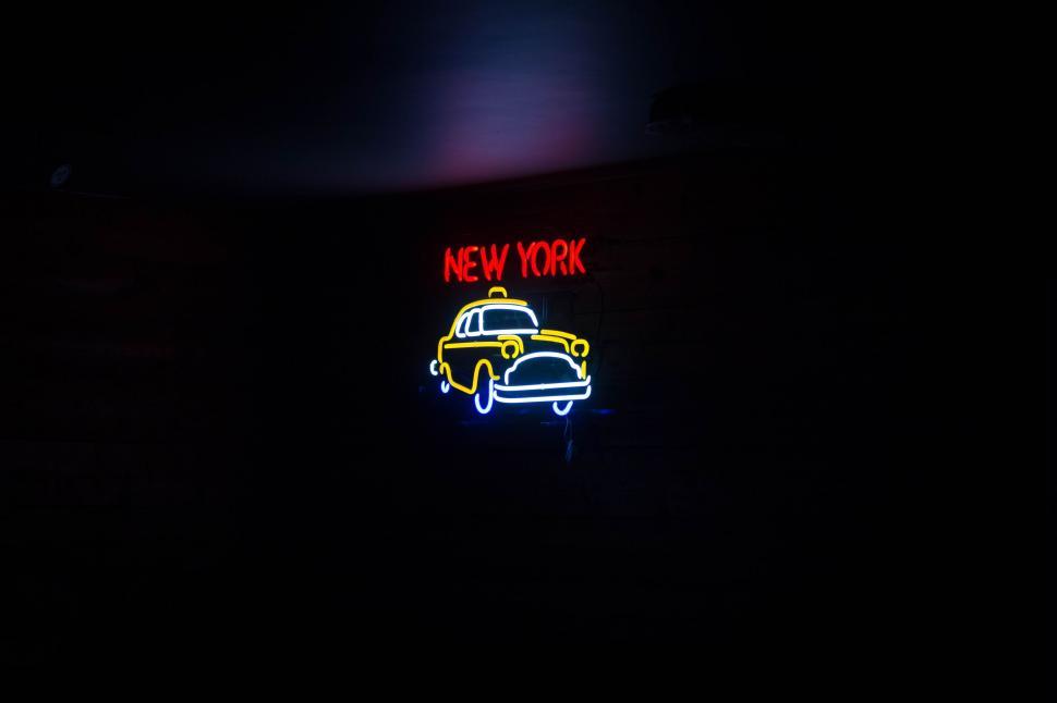 Free Image of Neon Sign Illuminating Building Facade 