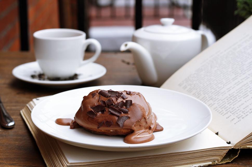 Free Image of White Plate With Chocolate Covered Donut 