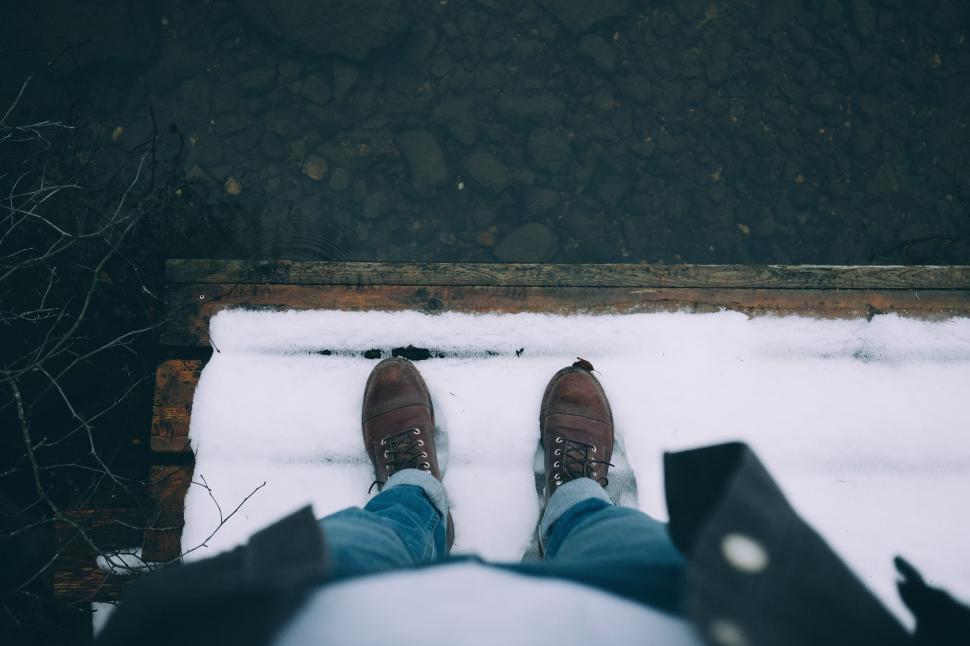 Free Image of Person Standing in Snow With Legs Raised 