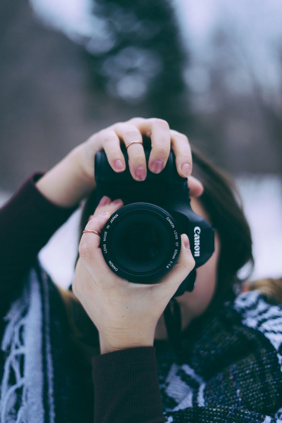 Free Image of Woman Taking a Picture With a Camera 