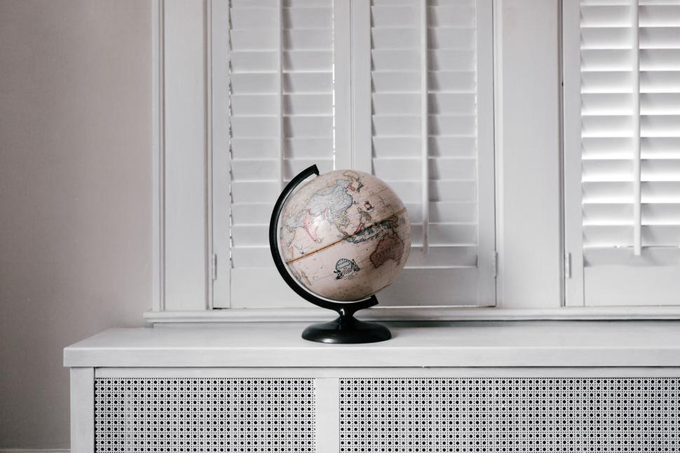 Free Image of Globe on White Cabinet 