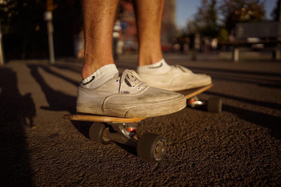 Free Image of Man Riding Skateboard Down Urban Street 