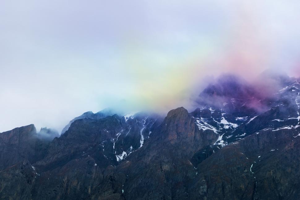 Free Image of Majestic Mountain With Rainbow Colored Cloud 