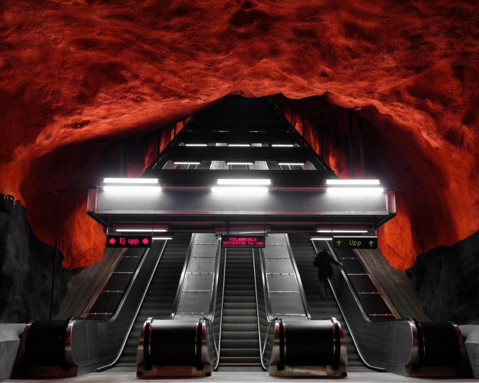 Free Image of Escalator in a Subway Station With Red Walls 