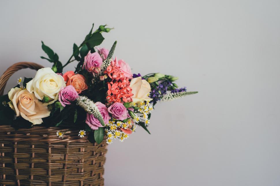 Free Image of Basket Filled With Flowers on Table 