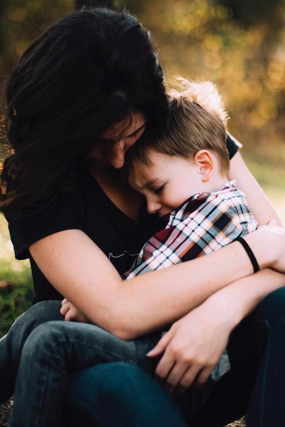 Free Image of Woman Hugging Child in Park 