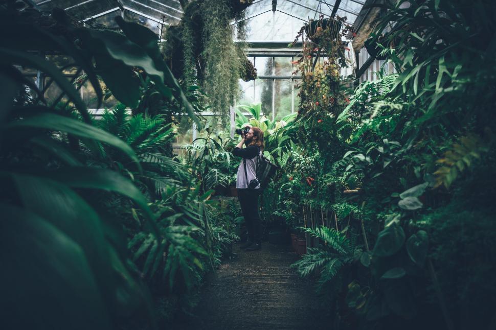 Free Image of Woman Holding Baby in Greenhouse 