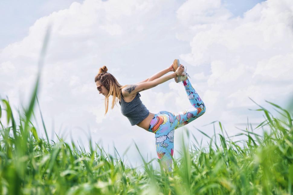 Free Image of Woman Practicing Yoga in Tall Grass Field 