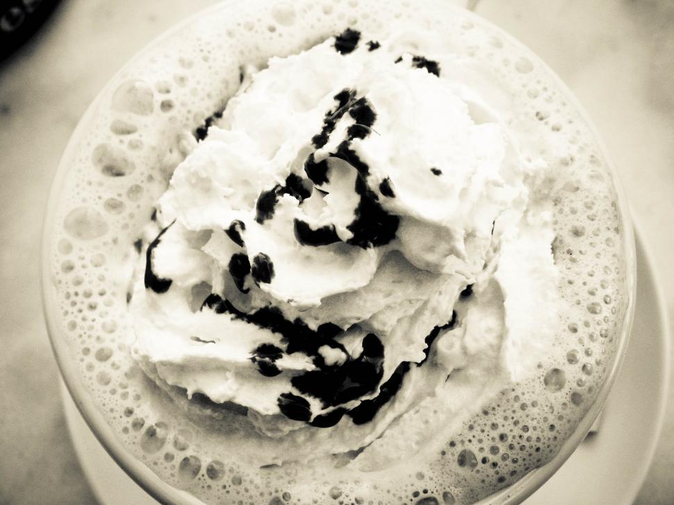 Free Image of Whipped cream topping a drink 