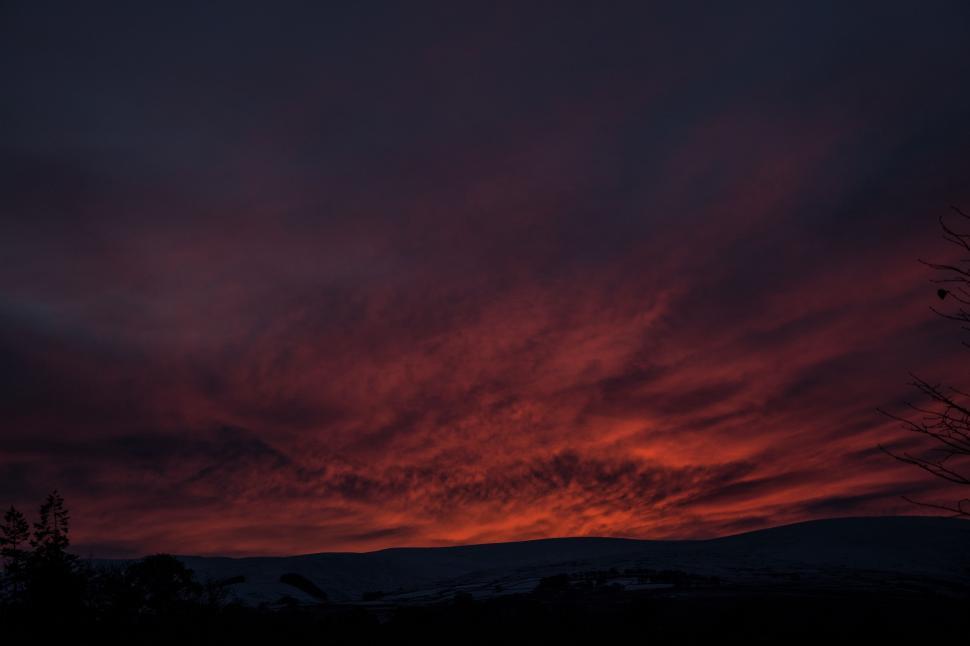 Free Image of Red Sky at Night With Clouds and Trees 