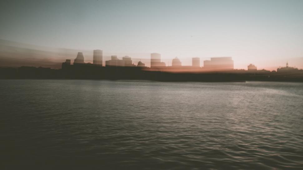 Free Image of Cityscape Overlooking a Vast Body of Water 