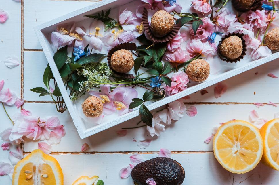Free Image of Tray With Oranges, Chocolates, and Flowers 