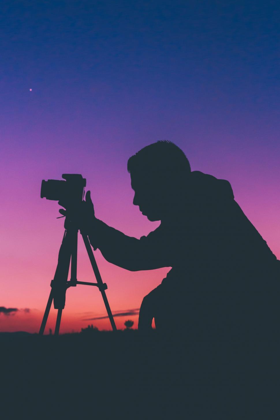 Free Image of Man Capturing Moments With Camera 