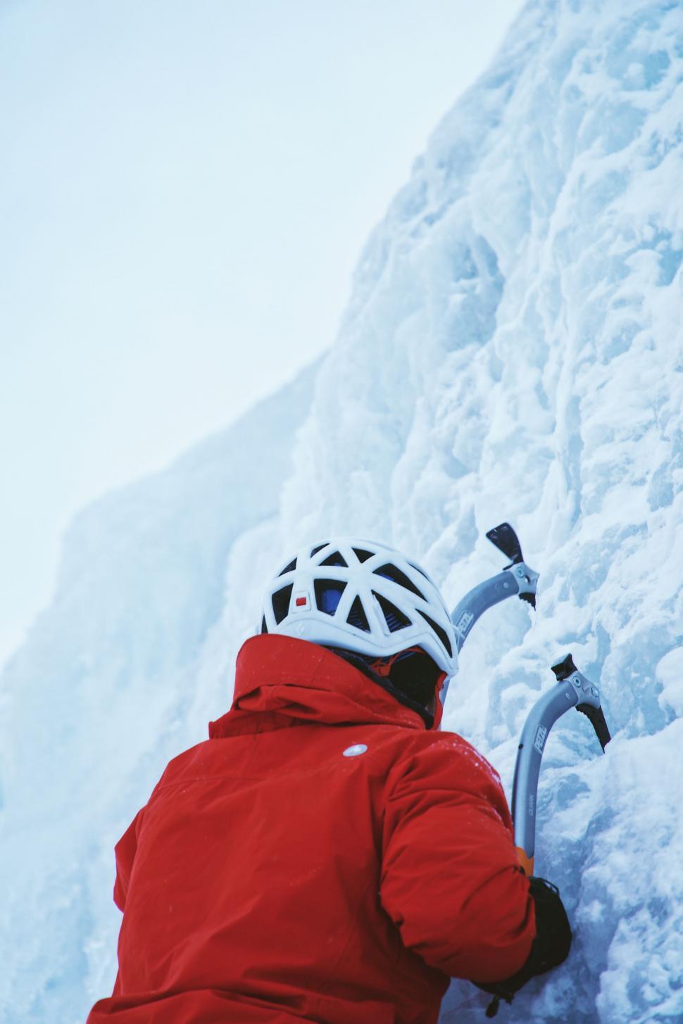 Free Image of Person Climbing Red Jacket Snowy Mountain 