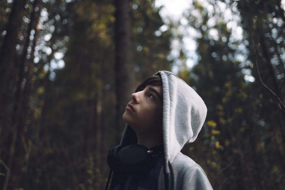 Free Image of Woman Wearing Hoodie in the Woods 