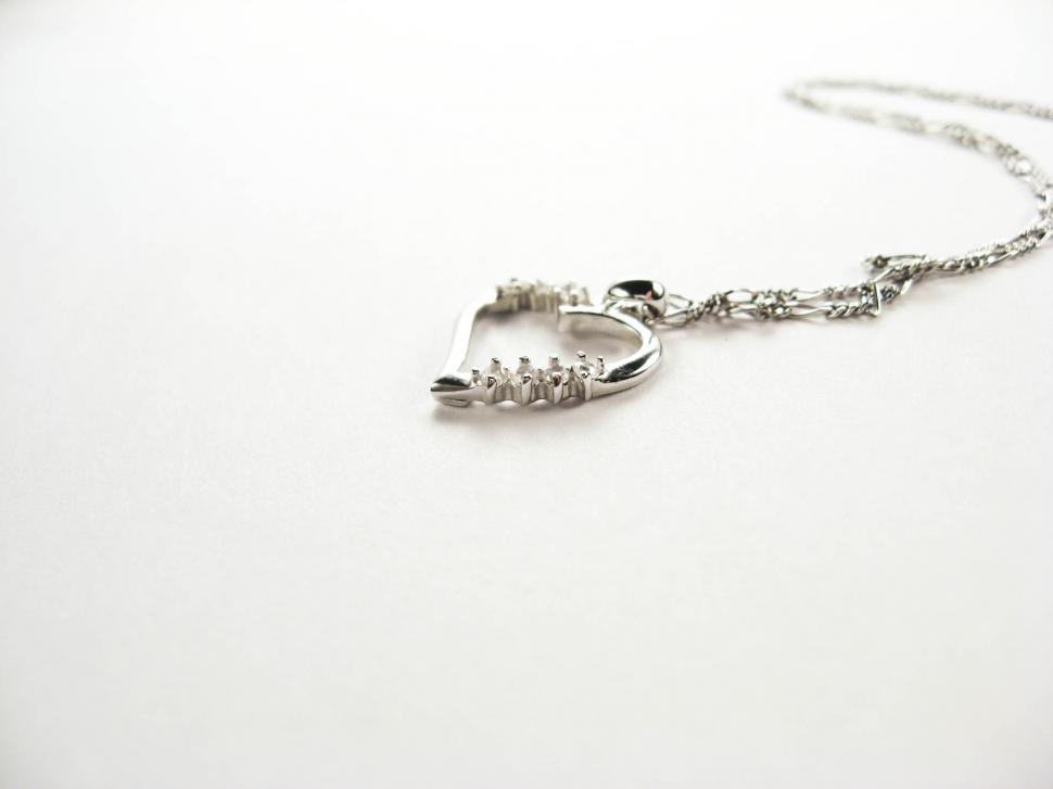 Free Image of silver necklace on white 