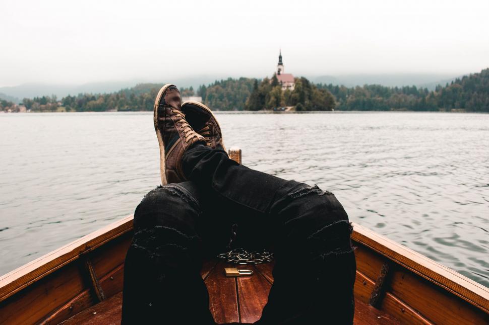 Free Image of Person Sitting in Boat on Lake 