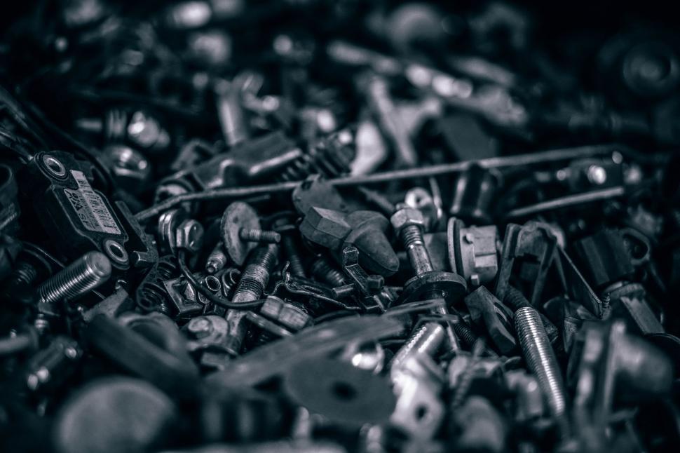 Free Image of A Pile of Screws and Nuts in Black and White 
