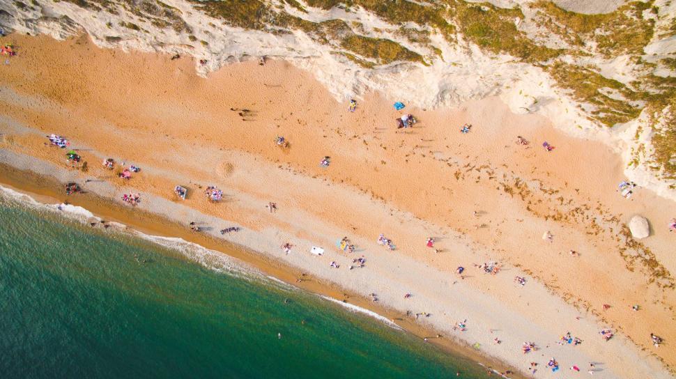 Free Image of Aerial View of Beach With People 