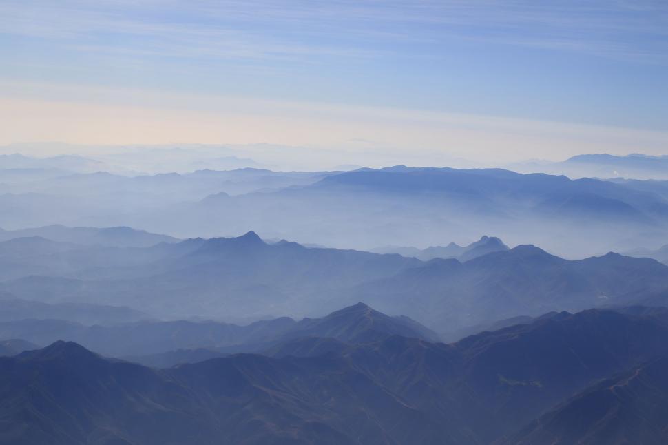 Free Image of A View of a Mountain Range From an Airplane 