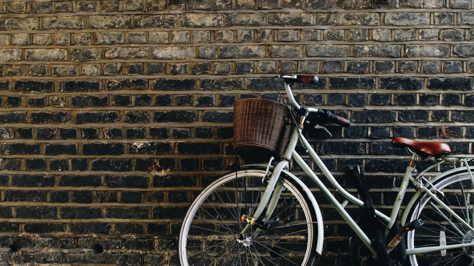 Free Image of Bicycle Leaning Against Brick Wall 