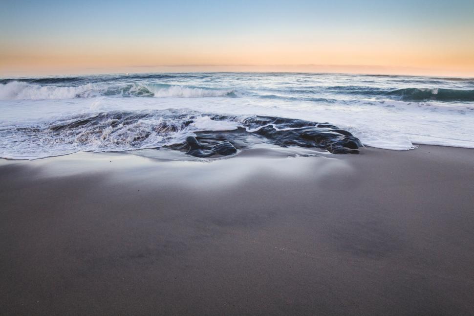 Free Image of Waves Rolling in and Out at Beach 