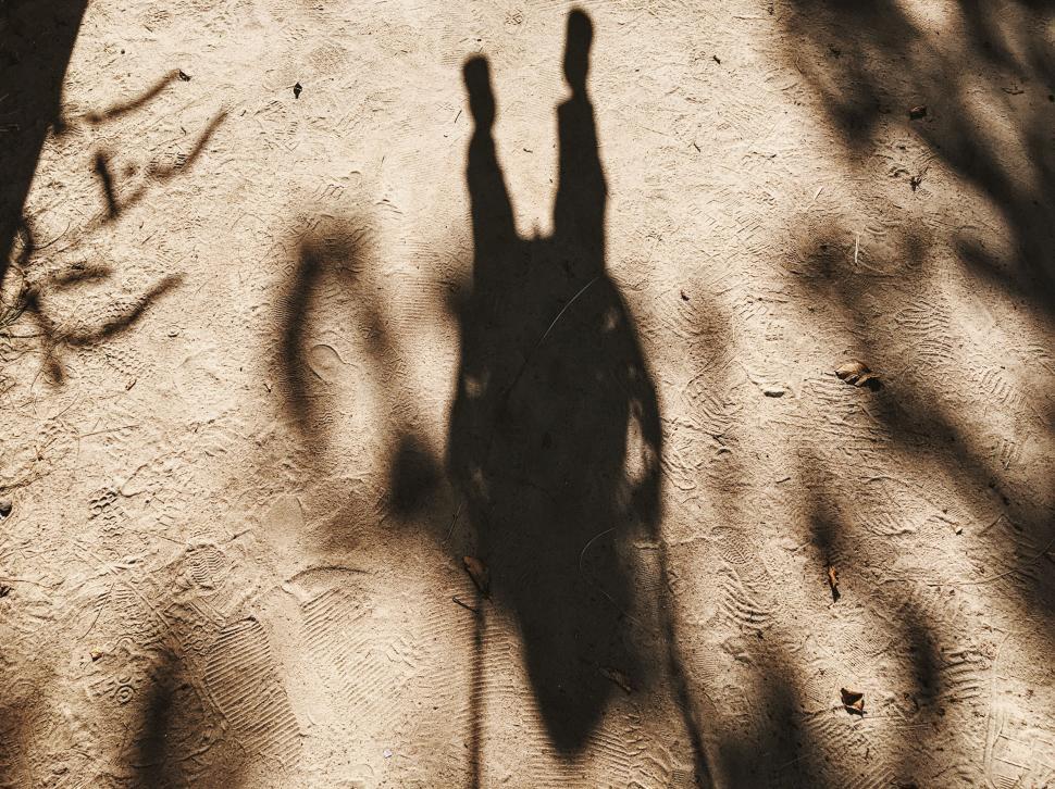 Free Image of Shadow of Person Standing on Sidewalk 