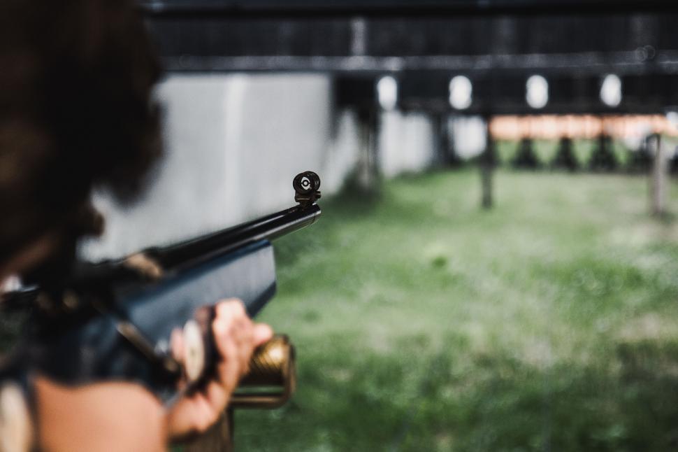 Free Image of Woman Aiming Gun at Target 