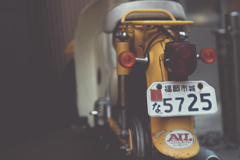 Free Image of Yellow Scooter With License Plate 